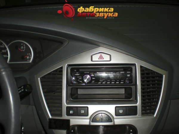 Установка магнитолы Panasonic Panasonic CQ-DX100W Kia Carens